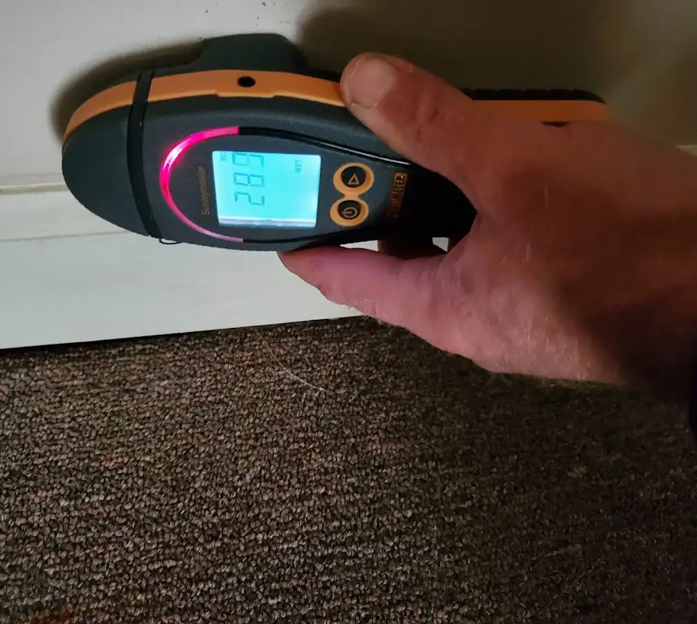 Moisture detection at baseboard during Storm Damage Restoration in Coal City